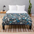 Plush blanket with a sketch-style book and reading-themed pattern