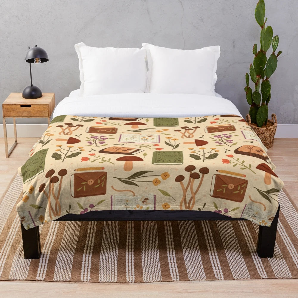 Plush blanket with a bookish forest and botanical pattern