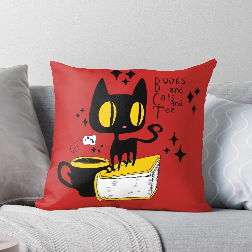 A soft, plush pillow featuring a charming illustration of books, cats, and tea in a retro, kawaii style.