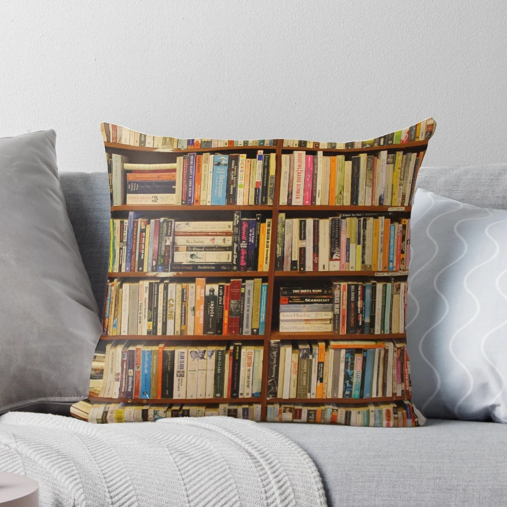 A plush, decorative pillow with a vintage books design, perfect for book lovers and creating a cozy reading nook.