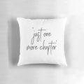 A decorative throw pillow with the text "Just One More Chapter" in a whimsical, hand-lettered style, perfect for book lovers and reading enthusiasts.
