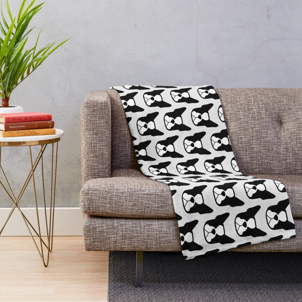 Boston Terrier face in black and white on a plush blanket with bold breed silhouette