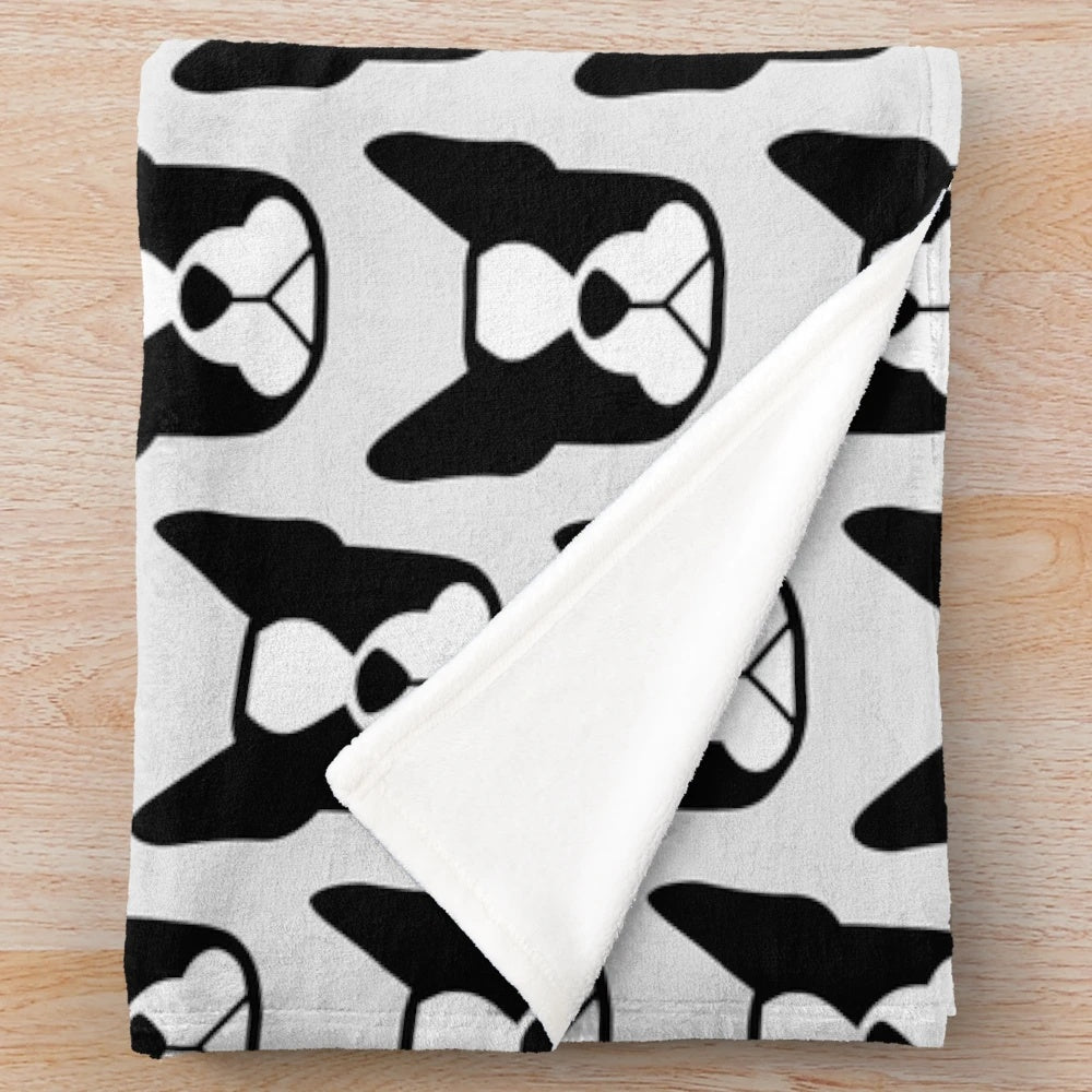 Boston Terrier face in black and white on a plush blanket with bold breed silhouette