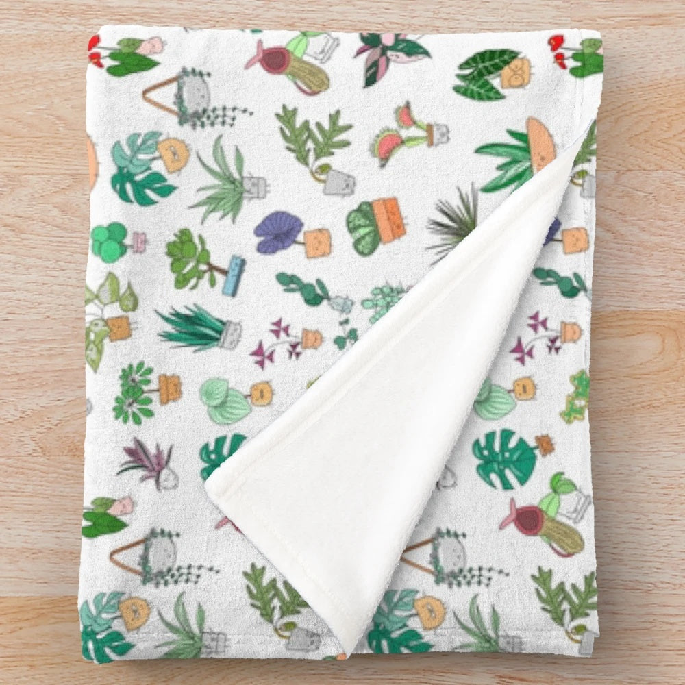 Plush blanket with a botanical plant alphabet pattern design