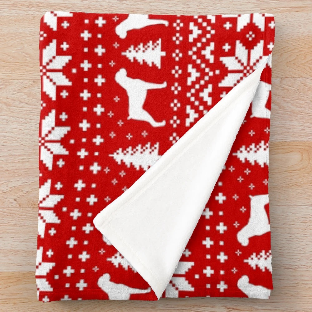 Boxer dog silhouettes in a festive red and white Christmas pattern on a plush blanket