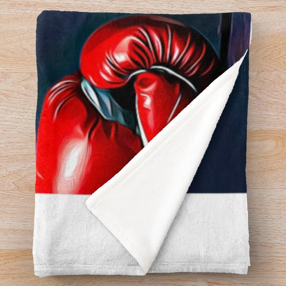 Boxer-inspired plush blanket with dog, fighter, and boxing glove design