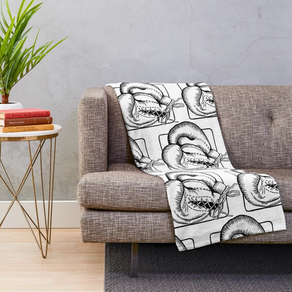 Soft and plush boxing gloves-themed blanket for boxing and sports enthusiasts