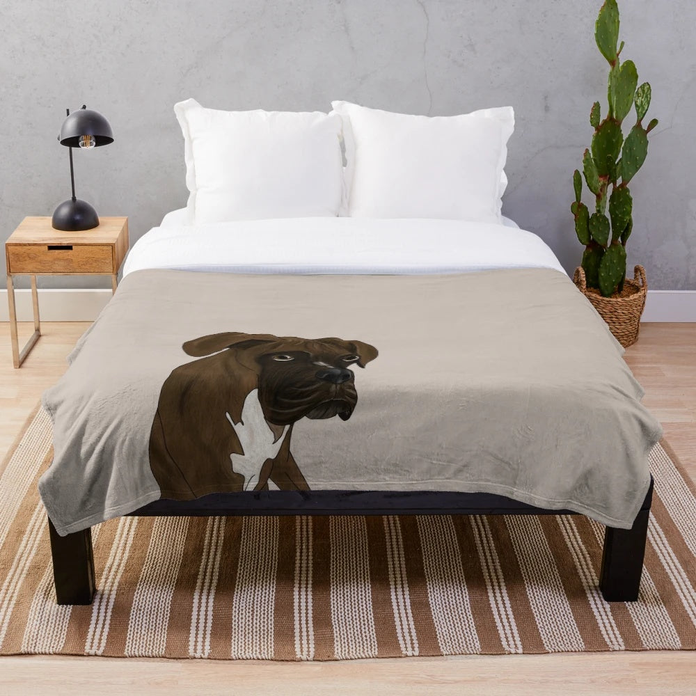Brindle boxer dog portrait on a plush blanket