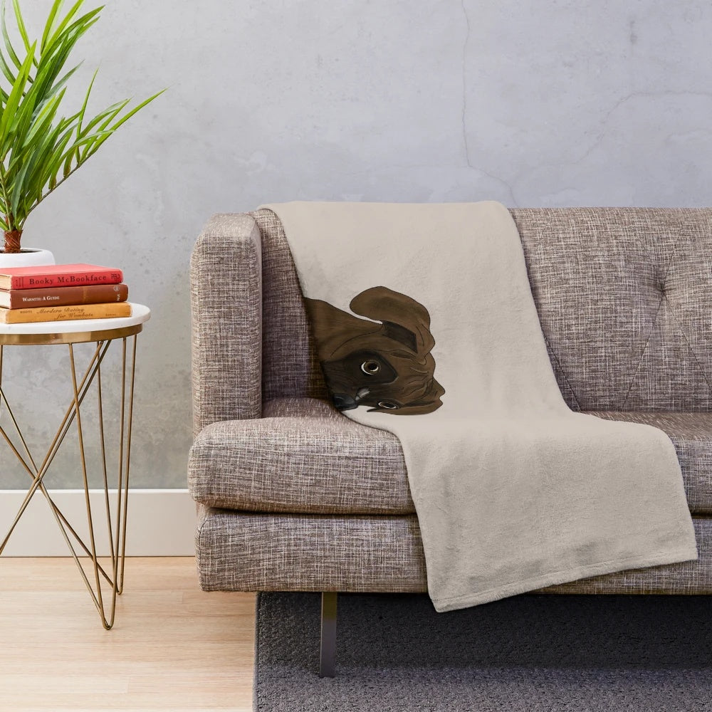 Brindle boxer dog portrait on a plush blanket