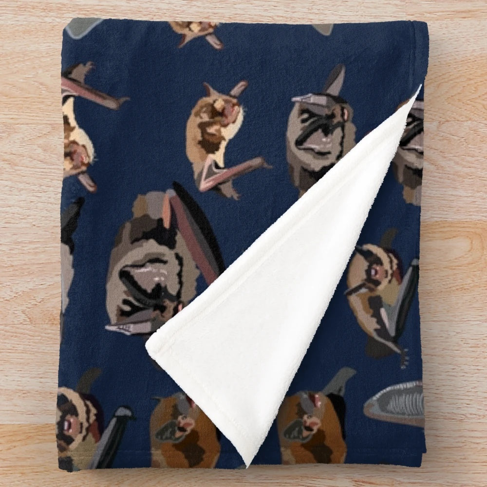 Plush blanket featuring a British bat illustration