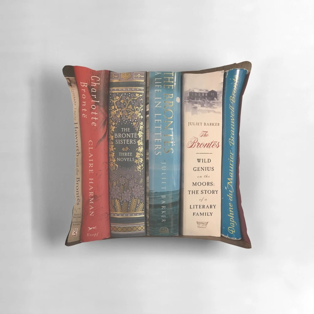 A plush pillow featuring book covers from the classic Brontë sisters' novels.