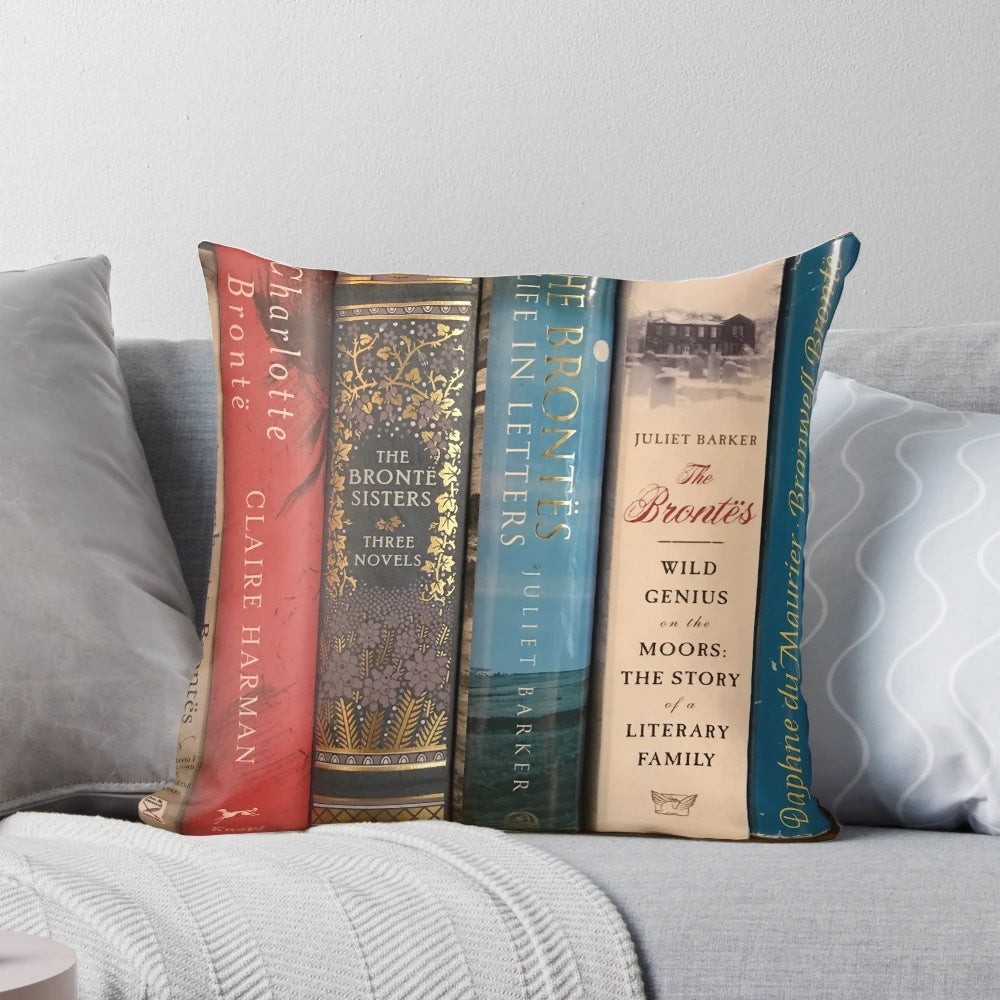 A plush pillow featuring book covers from the classic Brontë sisters' novels.