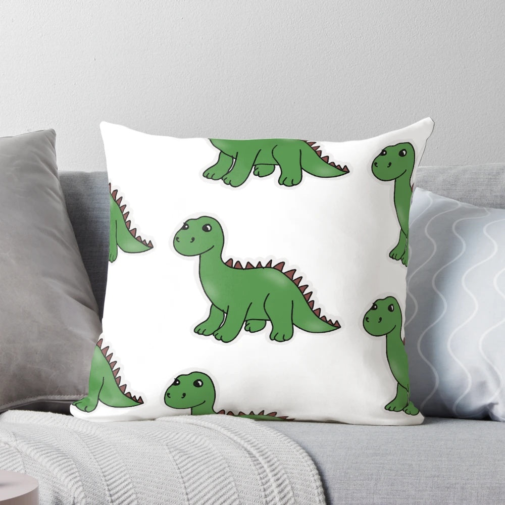 Soft and plush pillow featuring a cute brontosaurus dinosaur pattern in shades of green.