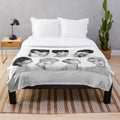 Plush blanket featuring a pencil drawing of the 7 members of the popular K-pop group BTS