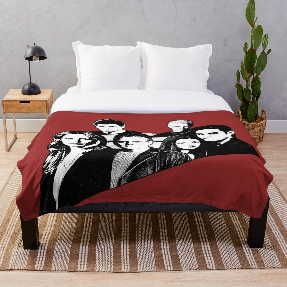 A cozy plush blanket featuring a Buffy the Vampire Slayer motif design