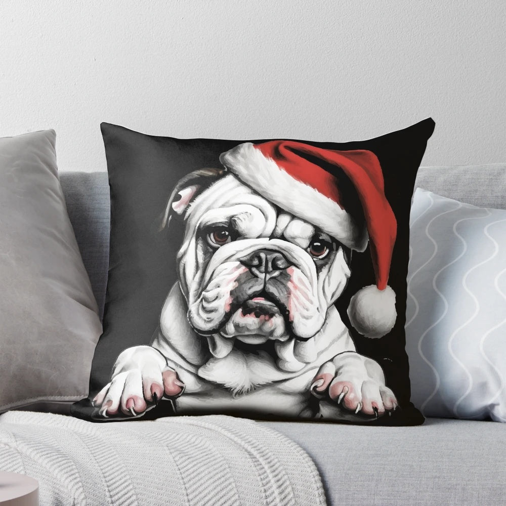 Adorable bulldog wearing a Santa hat on a plush Christmas-themed pillow