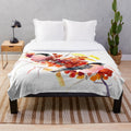 Plush blanket featuring a vintage-style illustration of two bullfinch birds surrounded by fall foliage and berries
