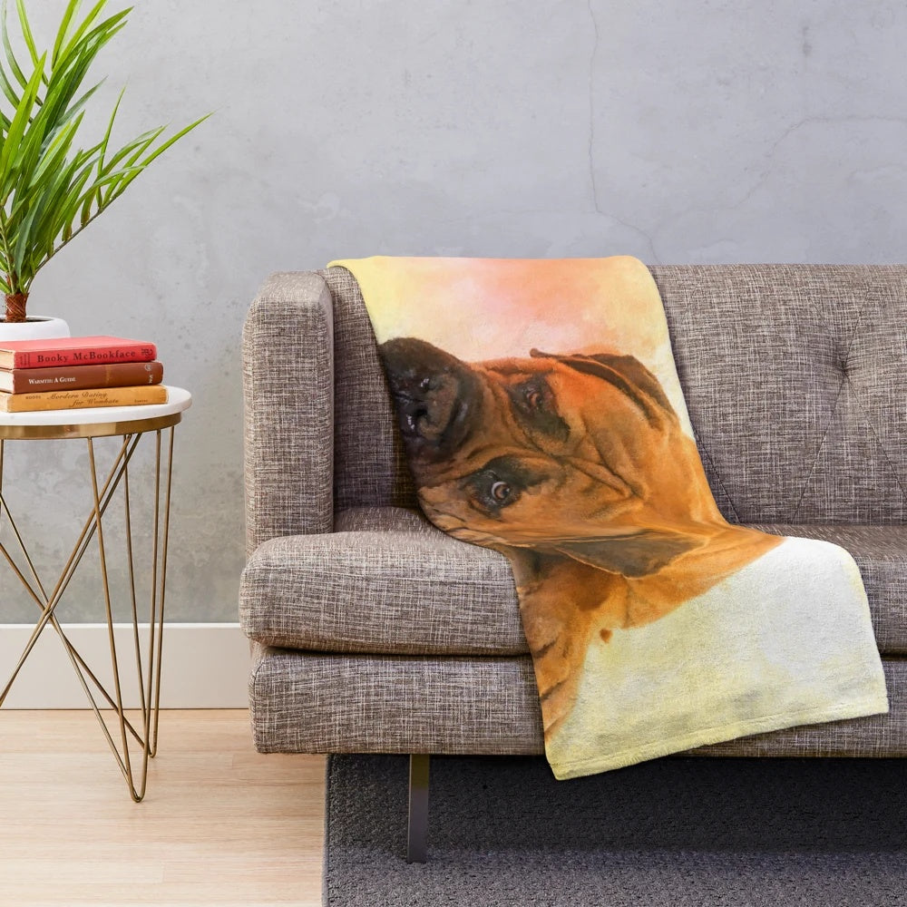 Bullmastiff dog portrait on a plush blanket