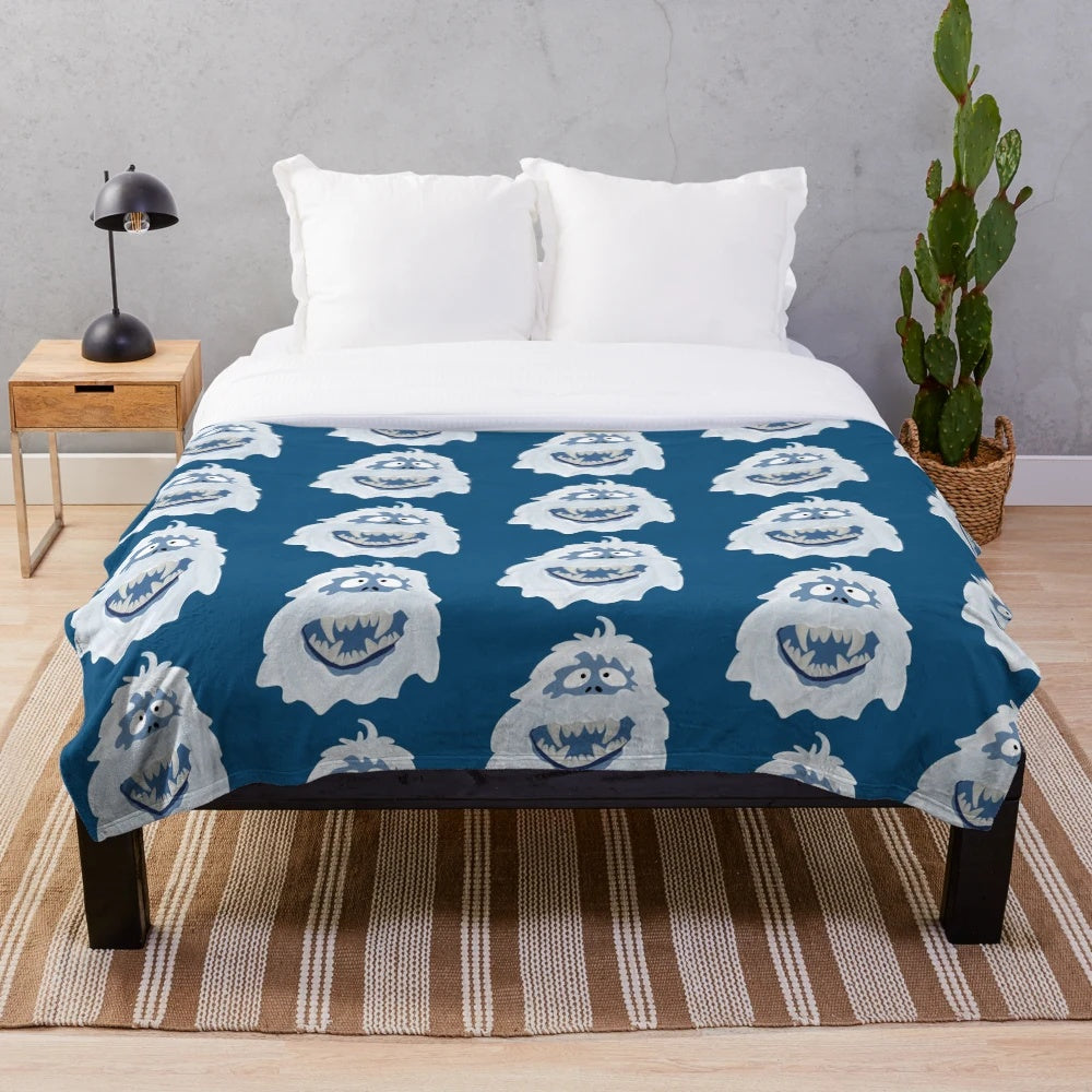 Soft white plush blanket featuring the iconic Bumble the Abominable Snowman character