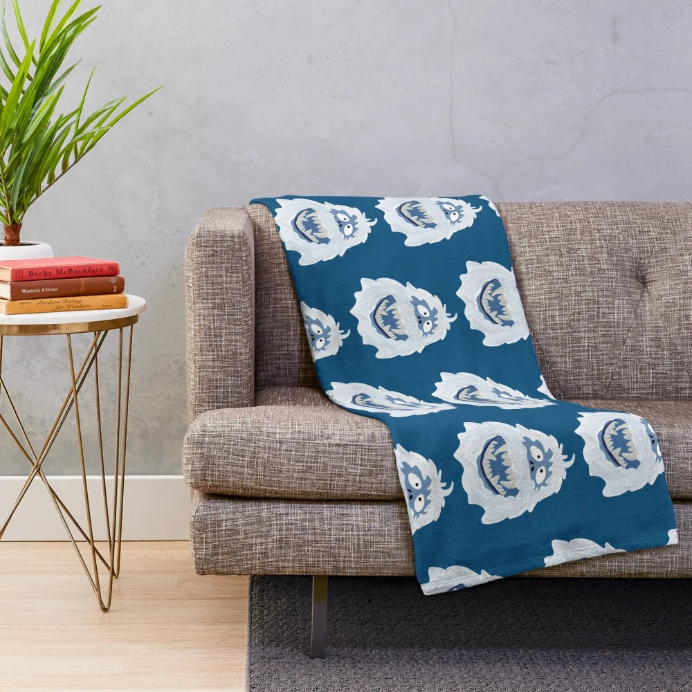 Soft white plush blanket featuring the iconic Bumble the Abominable Snowman character