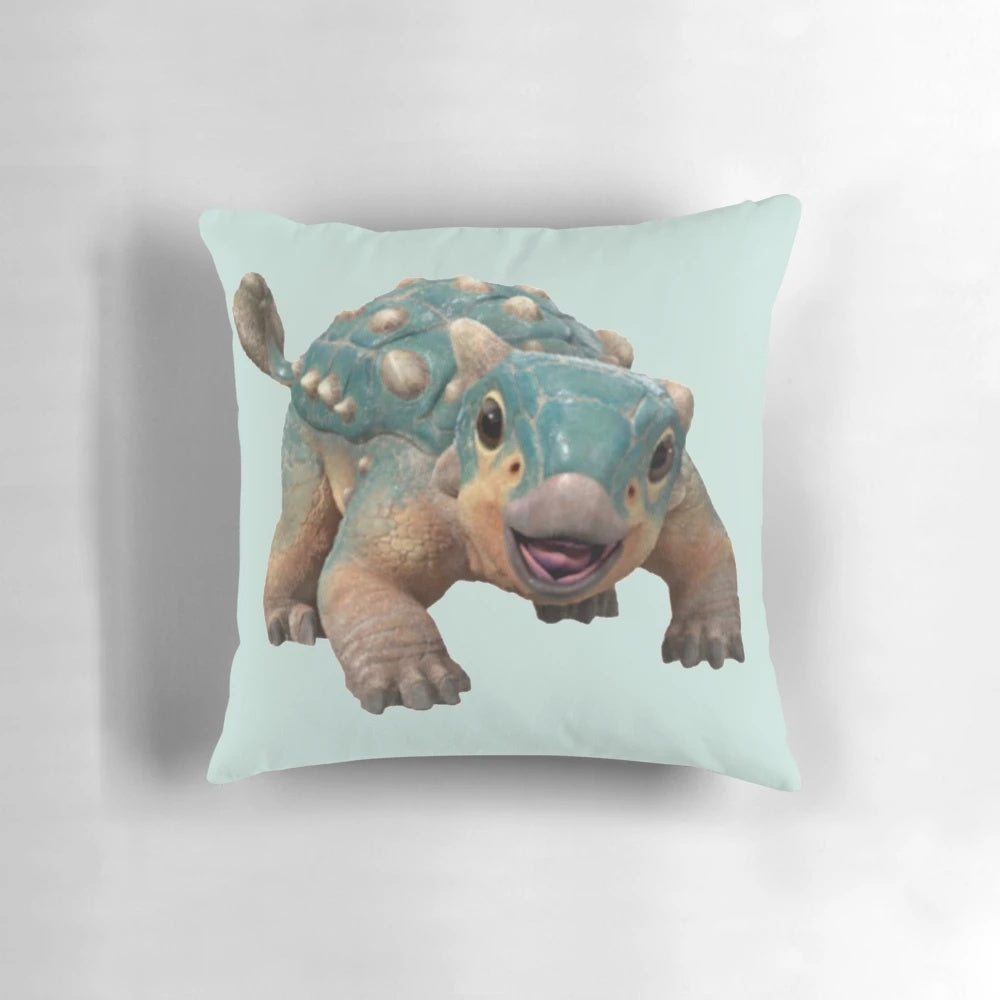 Soft, plush Pillow in the shape of a bumpy Ankylosaurus dinosaur, perfect for comfortable lounging and Netflix watching.