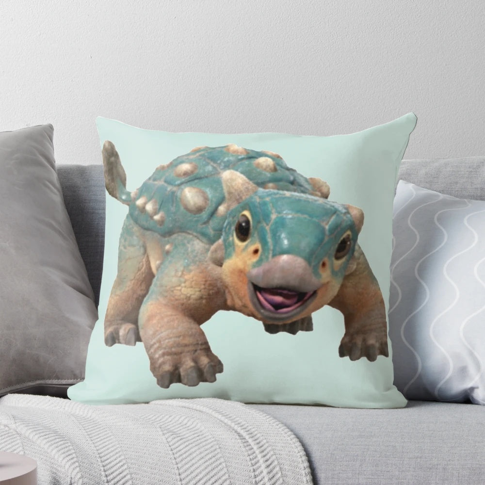 Soft, plush Pillow in the shape of a bumpy Ankylosaurus dinosaur, perfect for comfortable lounging and Netflix watching.