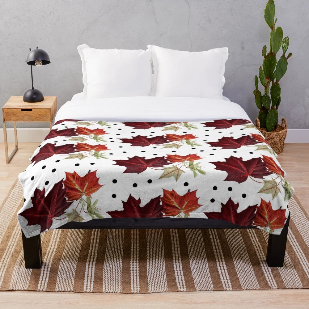 Burnt orange autumn pattern plush blanket with maple leaves detail