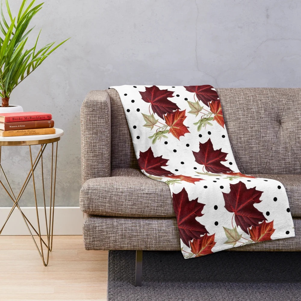Burnt orange autumn pattern plush blanket with maple leaves detail