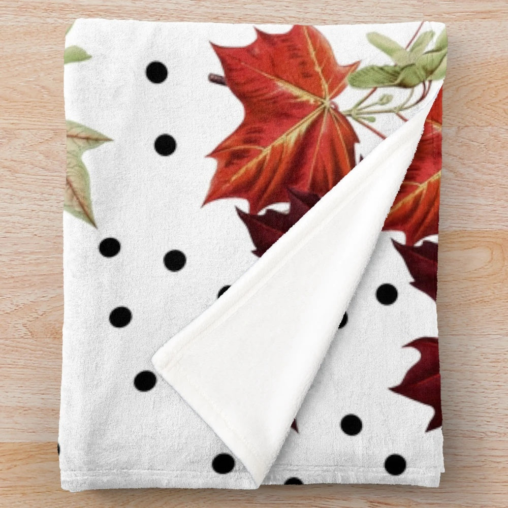 Burnt orange autumn pattern plush blanket with maple leaves detail