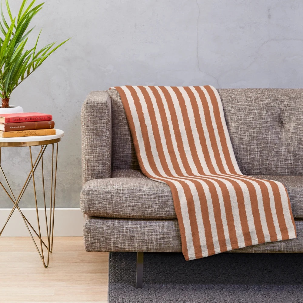 Burnt orange and cream striped plush blanket