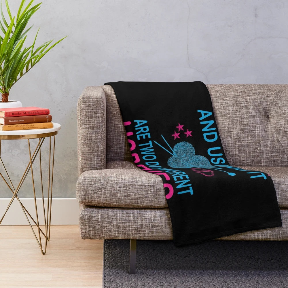 Plush blanket with funny "buying yarn and using it are two different hobbies" knitting design
