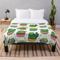 Cactus plush blanket with cartoon cat design