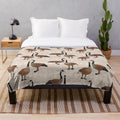 Canada Goose plush blanket with maple leaf and Canadian wildlife design