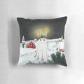 A fluffy white pillow with a charming candlelight design, perfect for a cozy winter home.