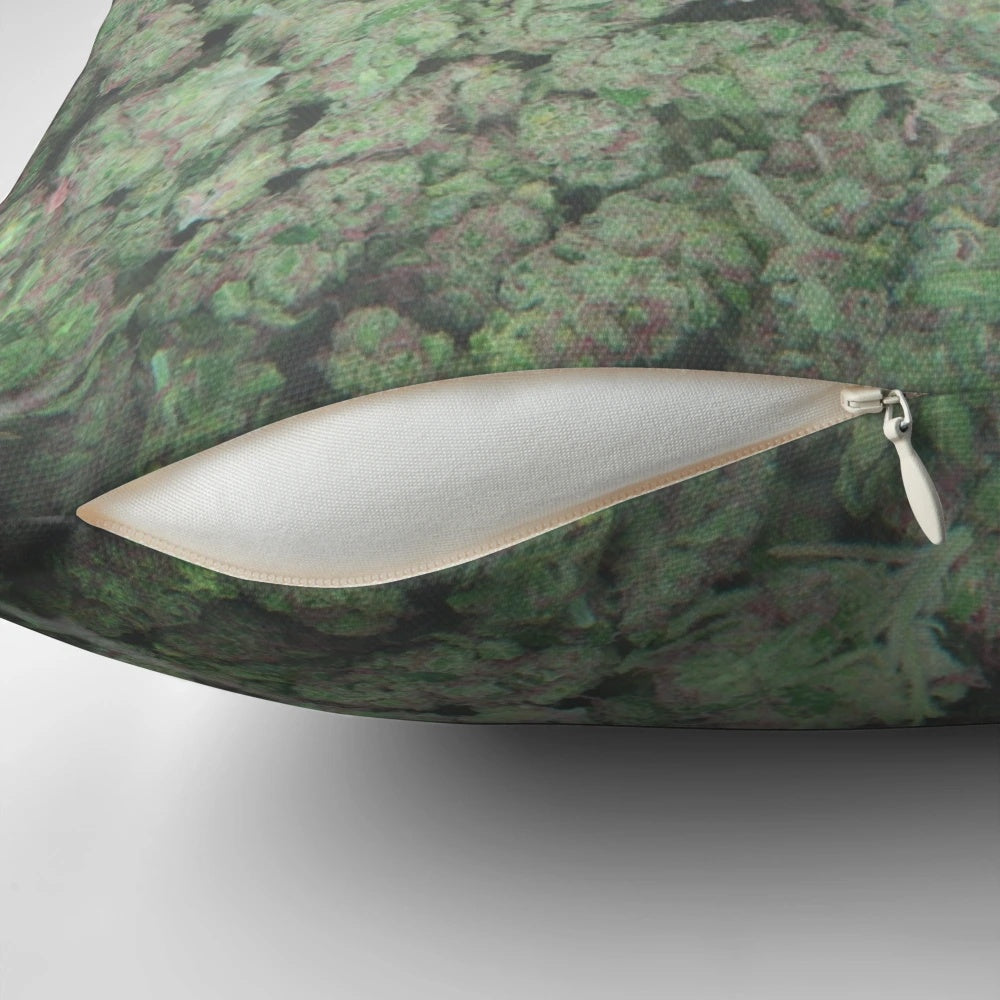 A plush, soft pillow featuring a playful cannabis-themed design.