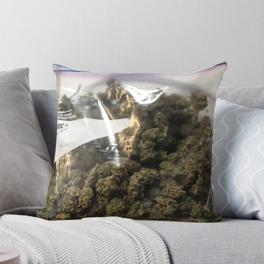 A plush, zippered pillow featuring a stylized cannabis leaf design