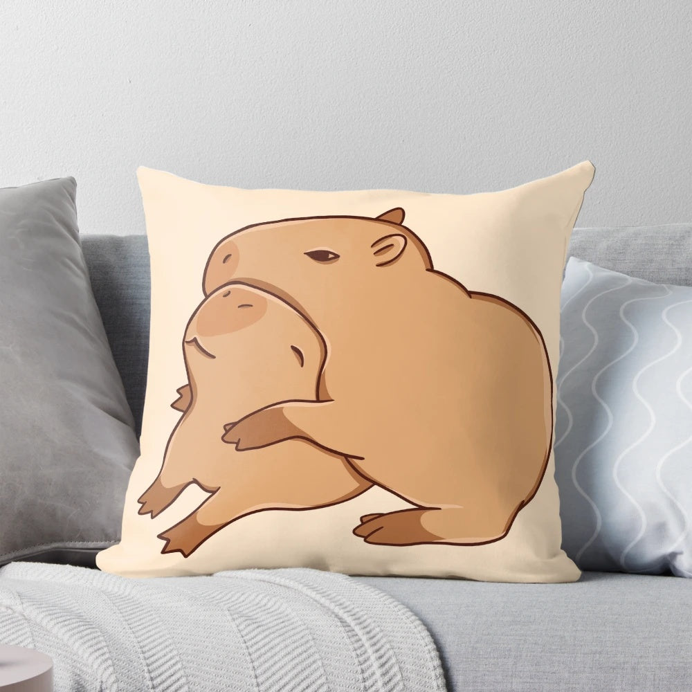 A soft, plush pillow featuring a cute, cartoon-style capybara in a comforting hugging pose.