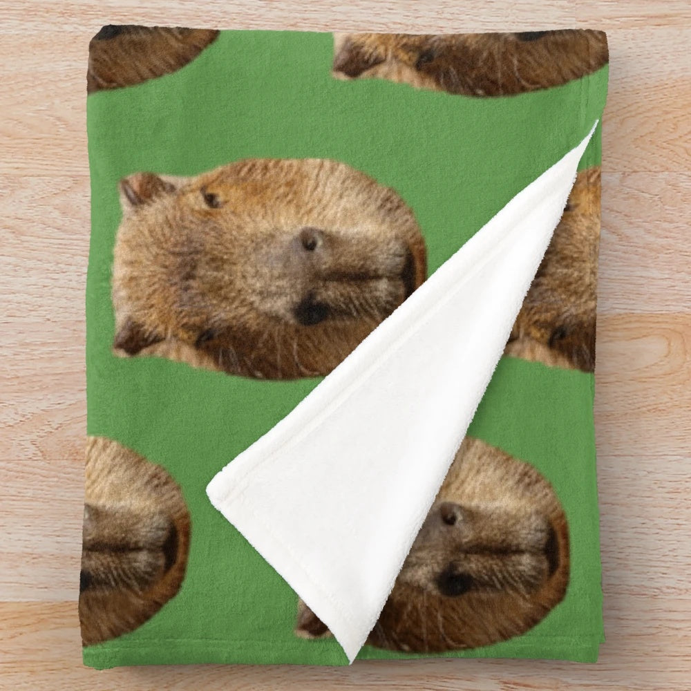 Capybara plush blanket featuring the adorable face of the semi-aquatic rodent