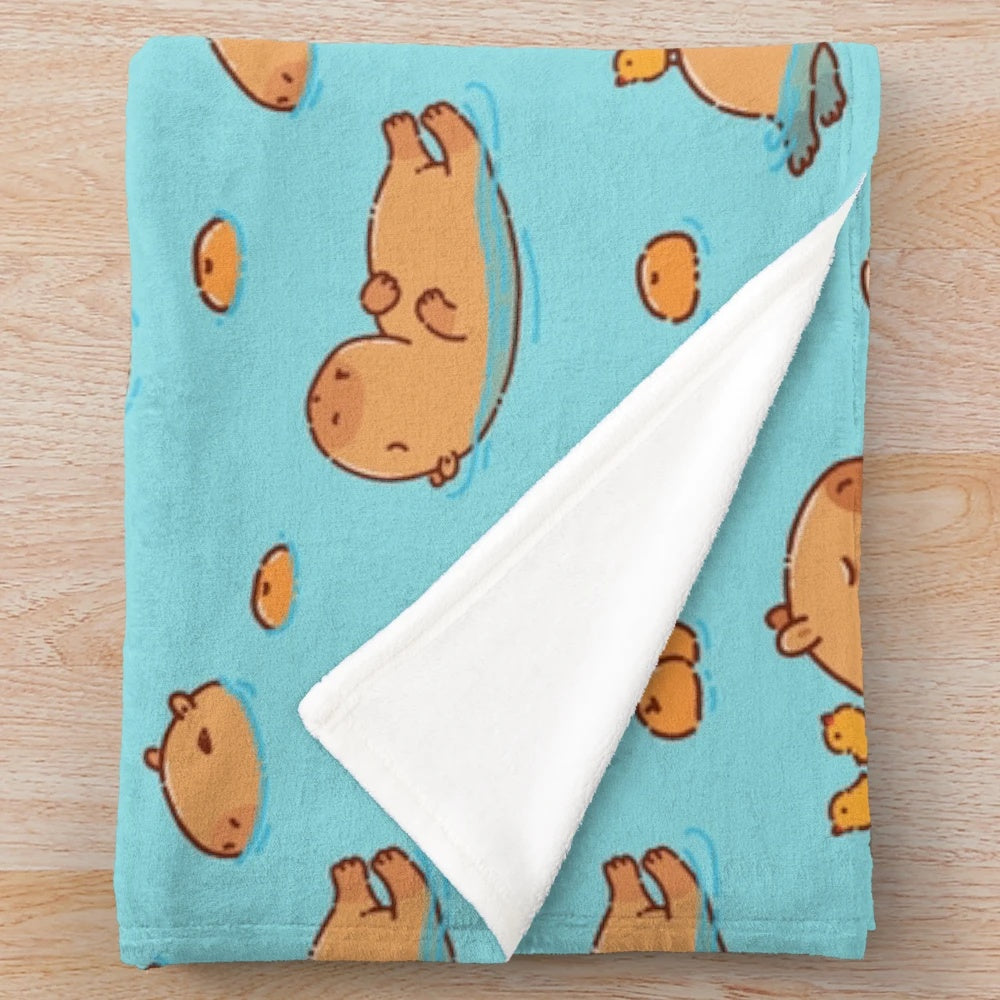 Capybara pattern swimming with oranges plush blanket
