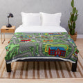 Plush car-themed blanket with road design for children's play and comfort