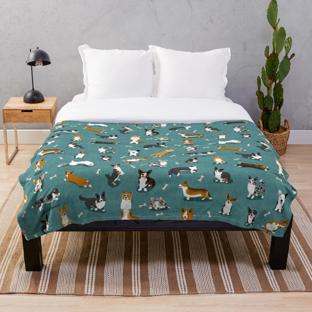 Cardigan Corgi pattern on a teal plush blanket