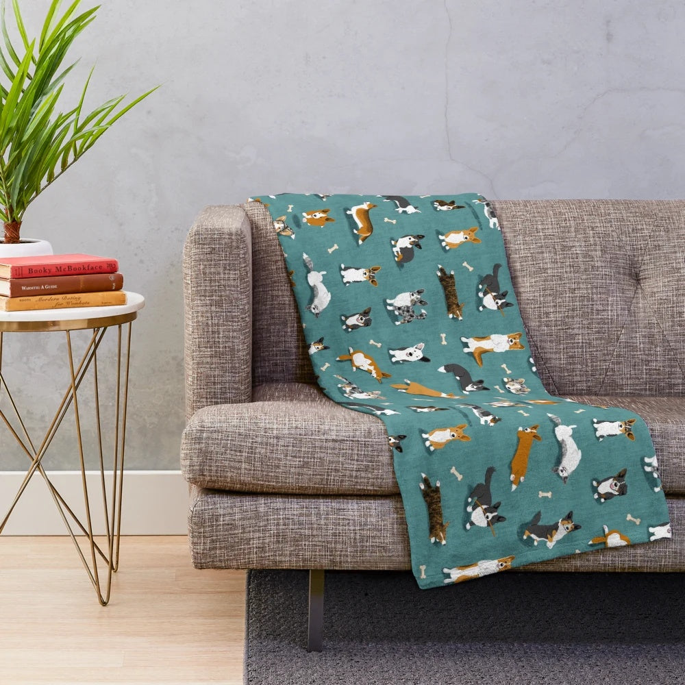 Cardigan Corgi pattern on a teal plush blanket