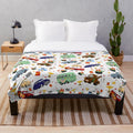 Plush blanket with Cars movie characters like Lightning McQueen, Mater, and Sally