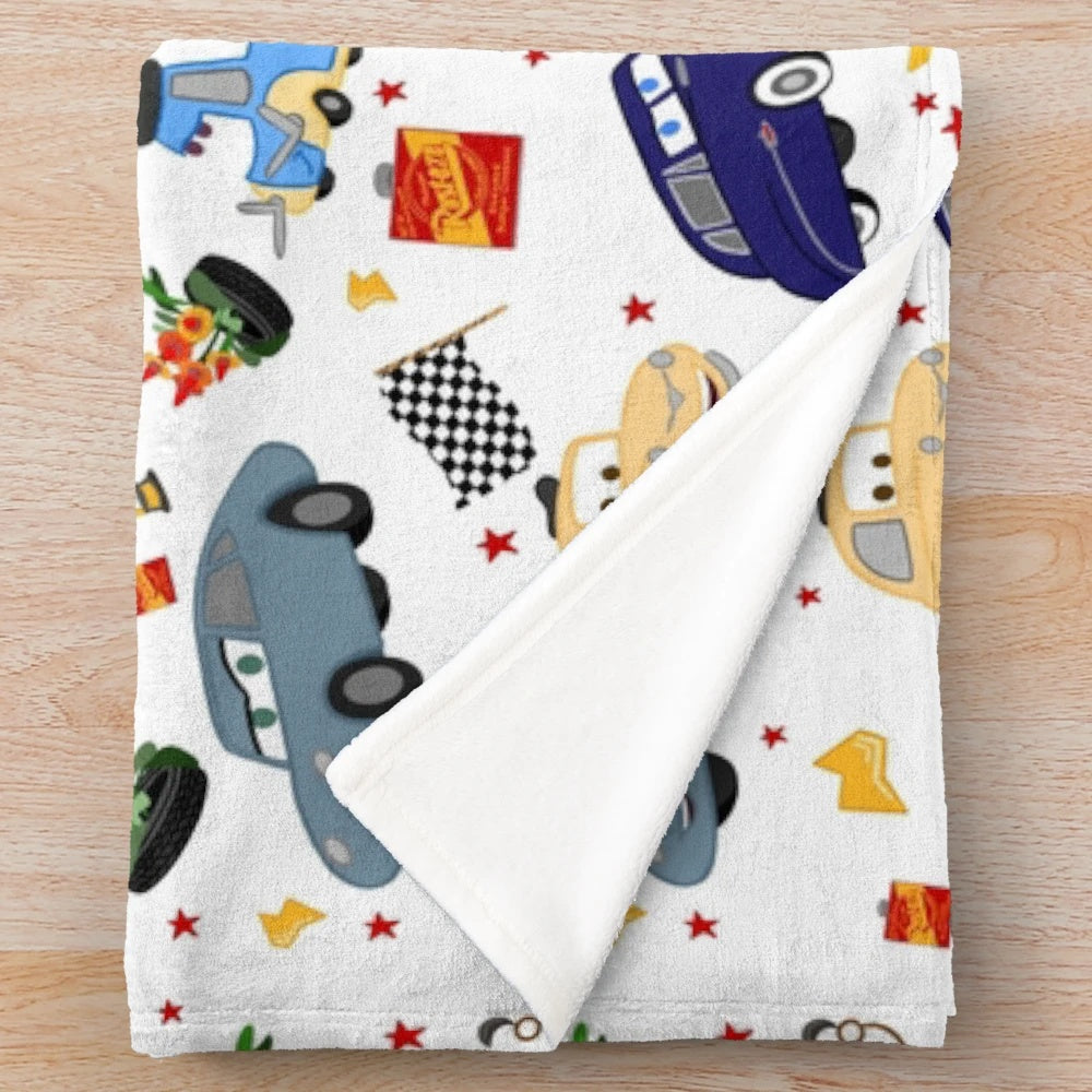 Plush blanket with Cars movie characters like Lightning McQueen, Mater, and Sally