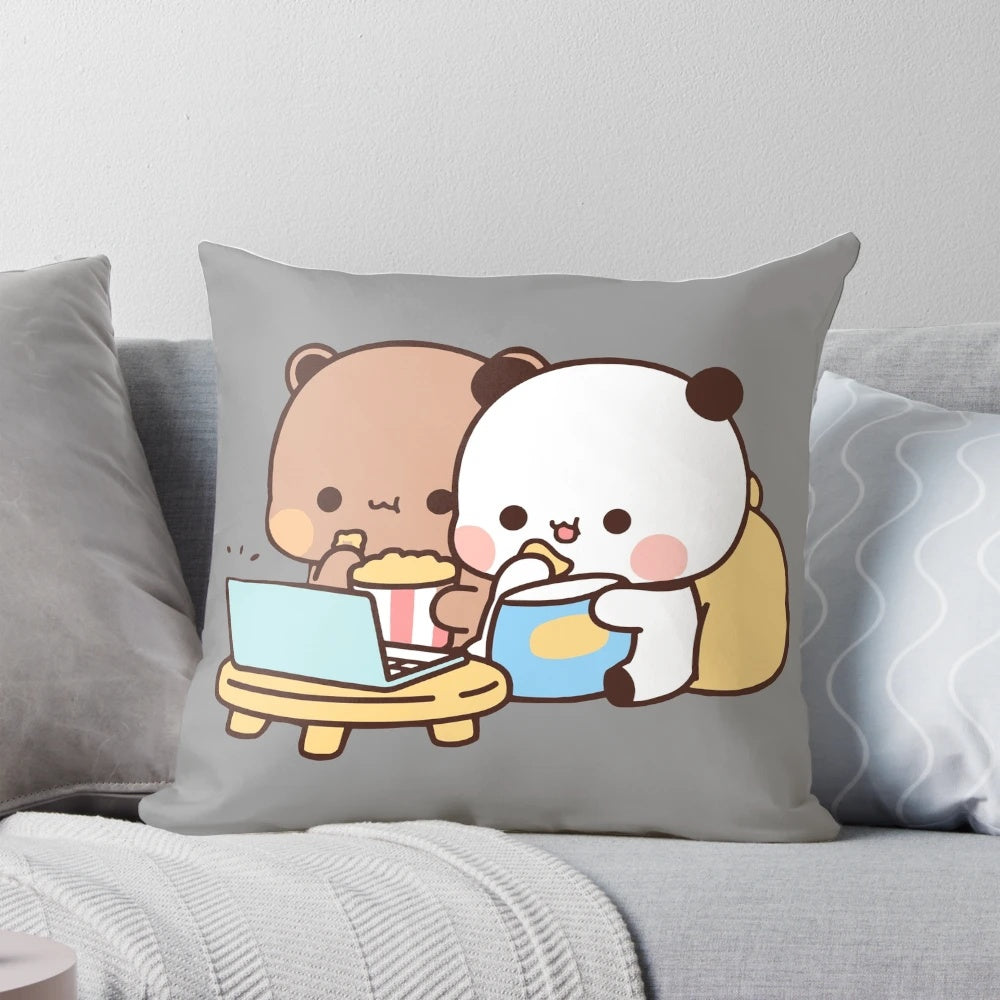 Cute cartoon bear and panda couple snuggled together on a soft decorative pillow