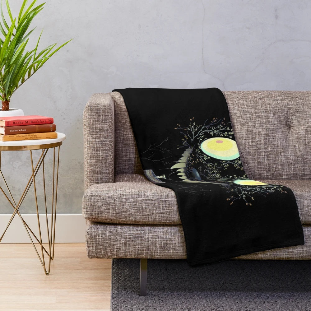 Cozy plush blanket featuring whimsical cartoon monster design inspired by the show Over the Garden Wall