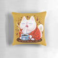 A dreamy white cat curled up on a pillow with a steaming cup of coffee, perfect for cat lovers and home decor.