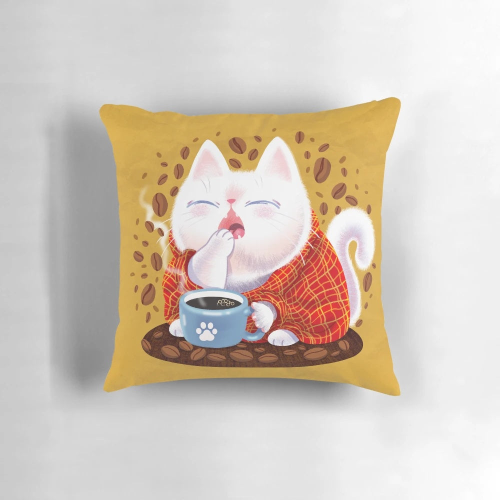 A dreamy white cat curled up on a pillow with a steaming cup of coffee, perfect for cat lovers and home decor.