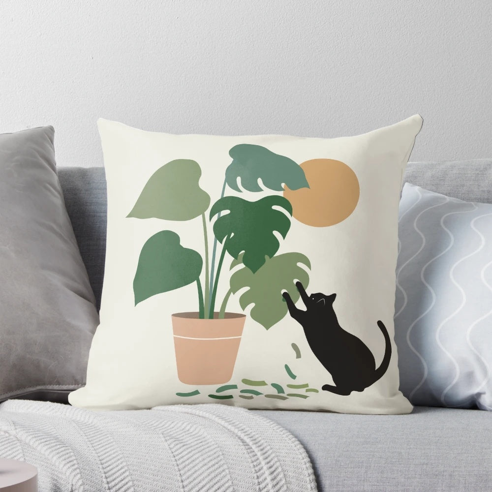 Decorative throw pillow with a black cat and lush monstera leaves pattern