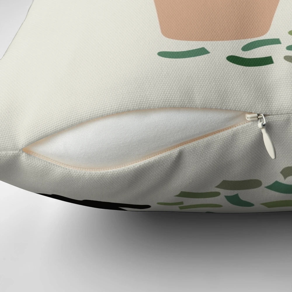 Decorative throw pillow with a black cat and lush monstera leaves pattern